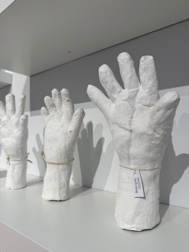 Htein Lin, A Show of Hands (ongoing, 2013-), surgical plaster and multimedia installation
