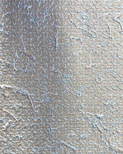 On the back of stitched silk