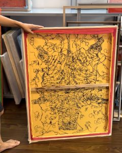 On the back of stitched silk